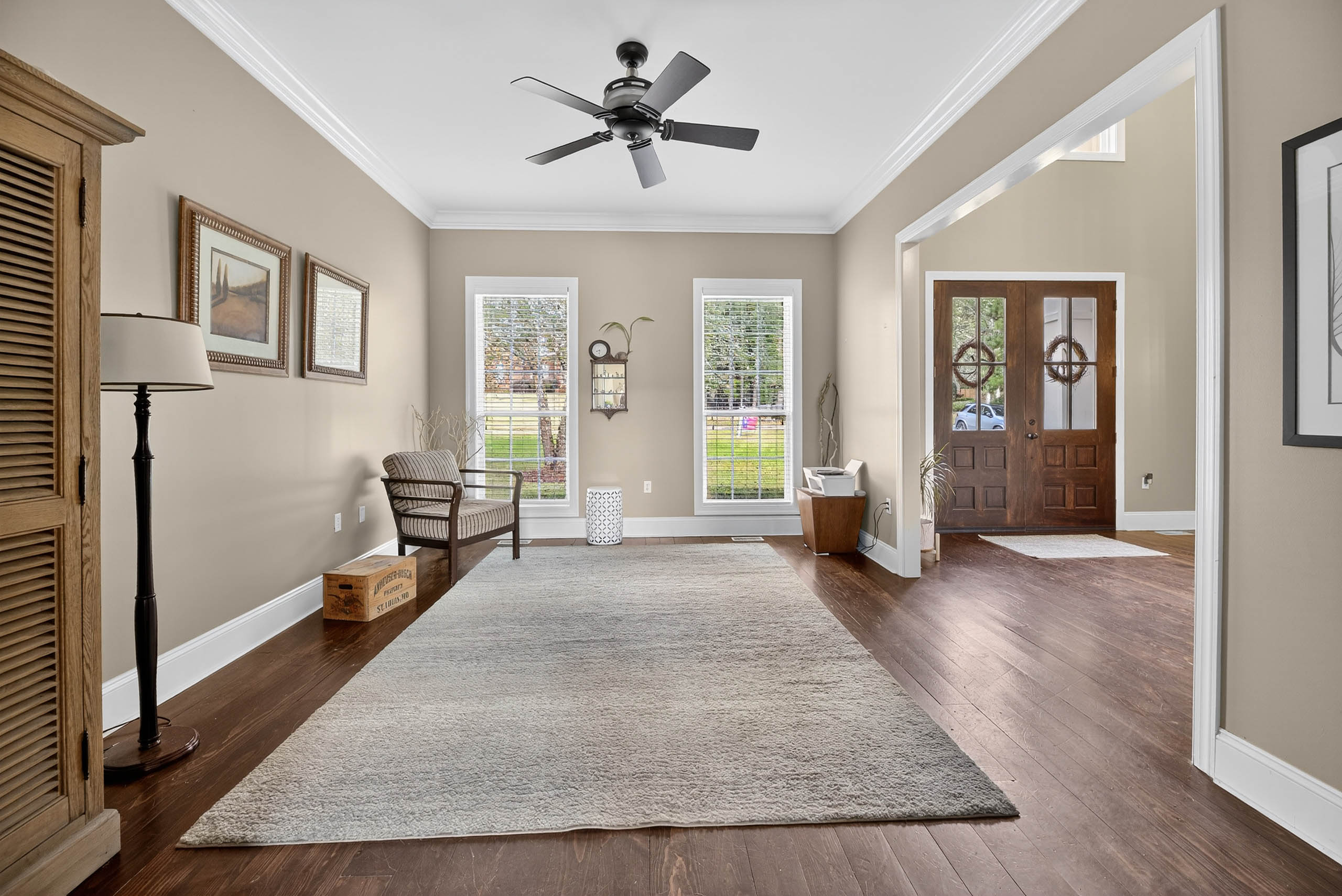 Open-concept great room with hardwood floors
