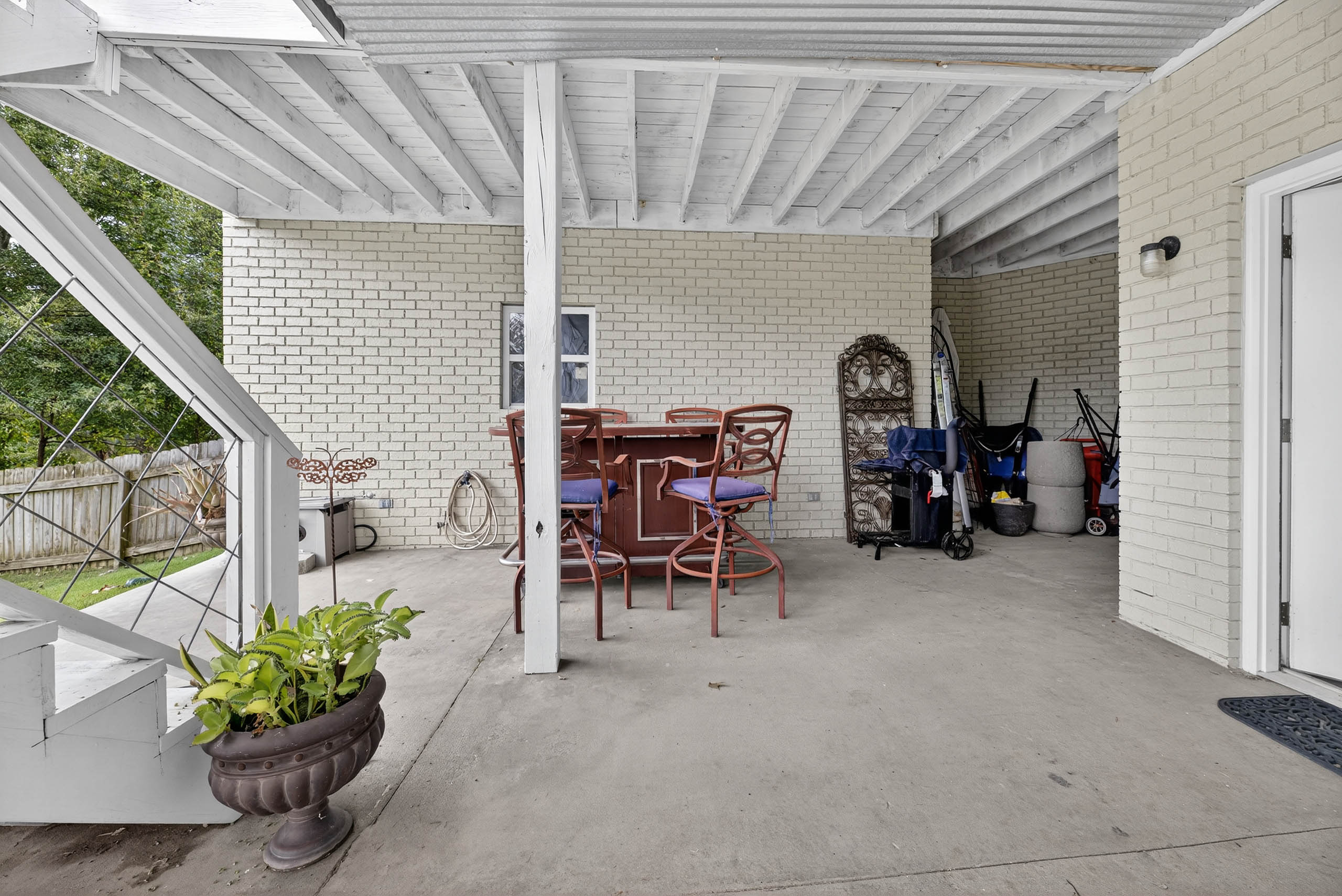 Covered Lower Patio — River Run riverfront estate